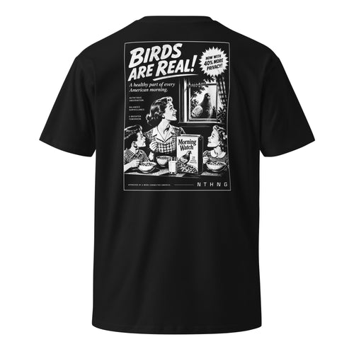 Back of black NTHNG Birds Are Real T-shirt with a white cereal-ad graphic showing a family at breakfast and a pigeon in a window.